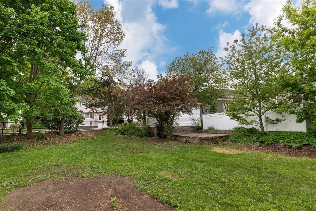 151 Forest Street Malden, MA 02148 - Photo 30 of 33 a view of a backyard with large trees