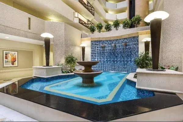a view of a living room and patio