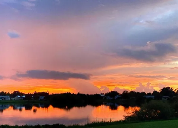 an empty room with sliding door and chandelier