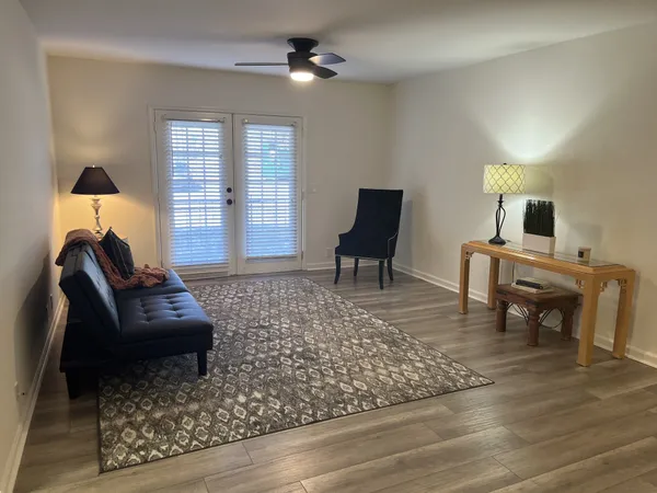 a living room with furniture and a table