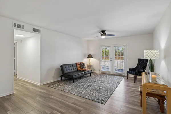 a view of a dining room with furniture and wooden floor