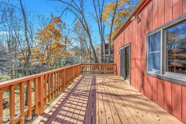 a spacious bathroom with a tub sink and mirror