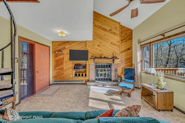 a view of a room with furniture and wooden floor