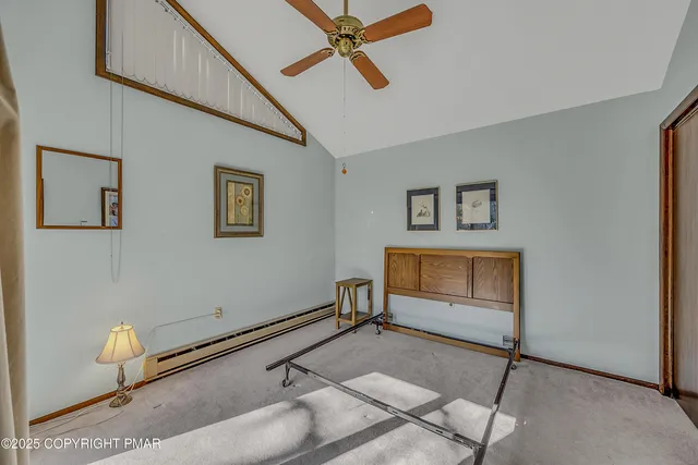 a bathroom with a shower curtain and a toilet