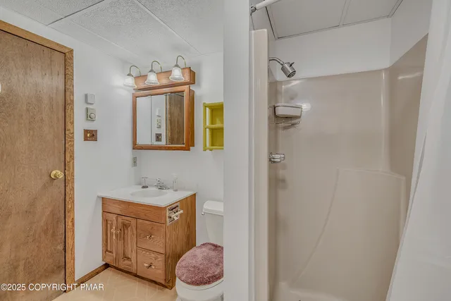 a view of a house with backyard porch and garden