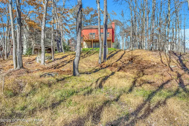 a living room with furniture windows and wooden floor