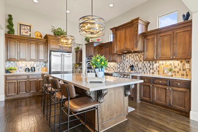 a view of a hallway view with wooden floor and a living room