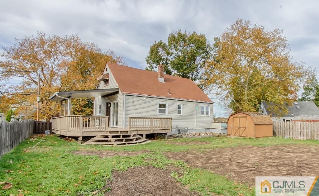 31 Longfield Road New Brunswick, NJ 08901 - Photo 13 of 15 a front view of a house with a garden and tree