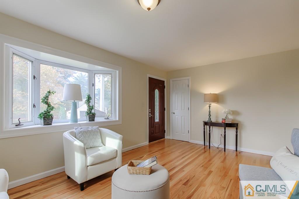 31 Longfield Road New Brunswick, NJ 08901 - Photo 4 of 15 a living room with furniture and a large window
