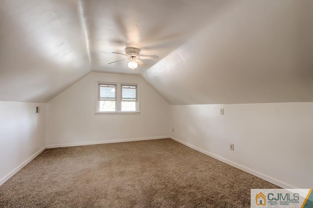 31 Longfield Road New Brunswick, NJ 08901 - Photo 10 of 15 wooden floor in an empty room with a window
