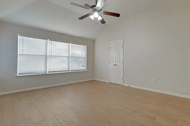 a view of an empty room with a window