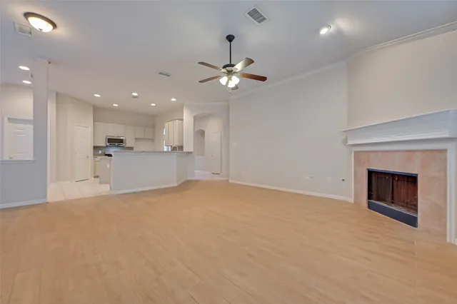 a view of a kitchen with a sink and a fireplace