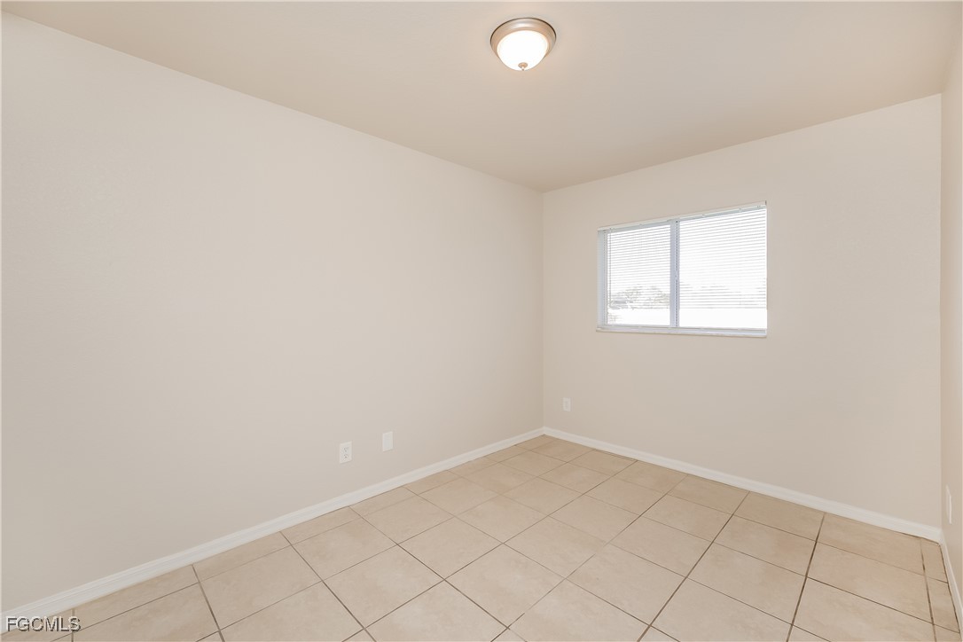 3704 6th Street Southwest Lehigh Acres, FL 33976 - Photo 12 of 16 an empty room with a window