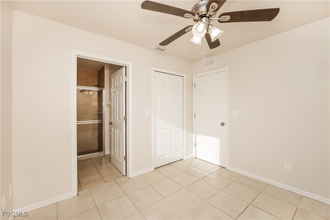3704 6th Street Southwest Lehigh Acres, FL 33976 - Photo 10 of 16 a view of an empty room and chandelier fan