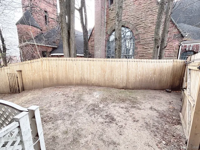 a view of outdoor space yard and wooden fence