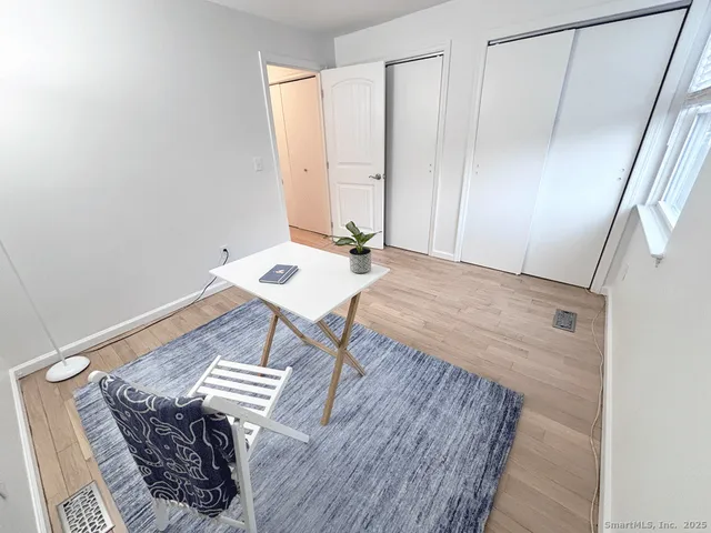 a view of a table and chairs in a room