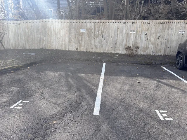 a view of a utility room with a wooden fence