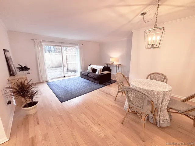 a bedroom with a bed and chandelier