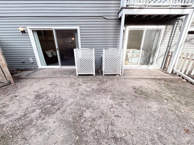 a view of a house with a door and wooden floor