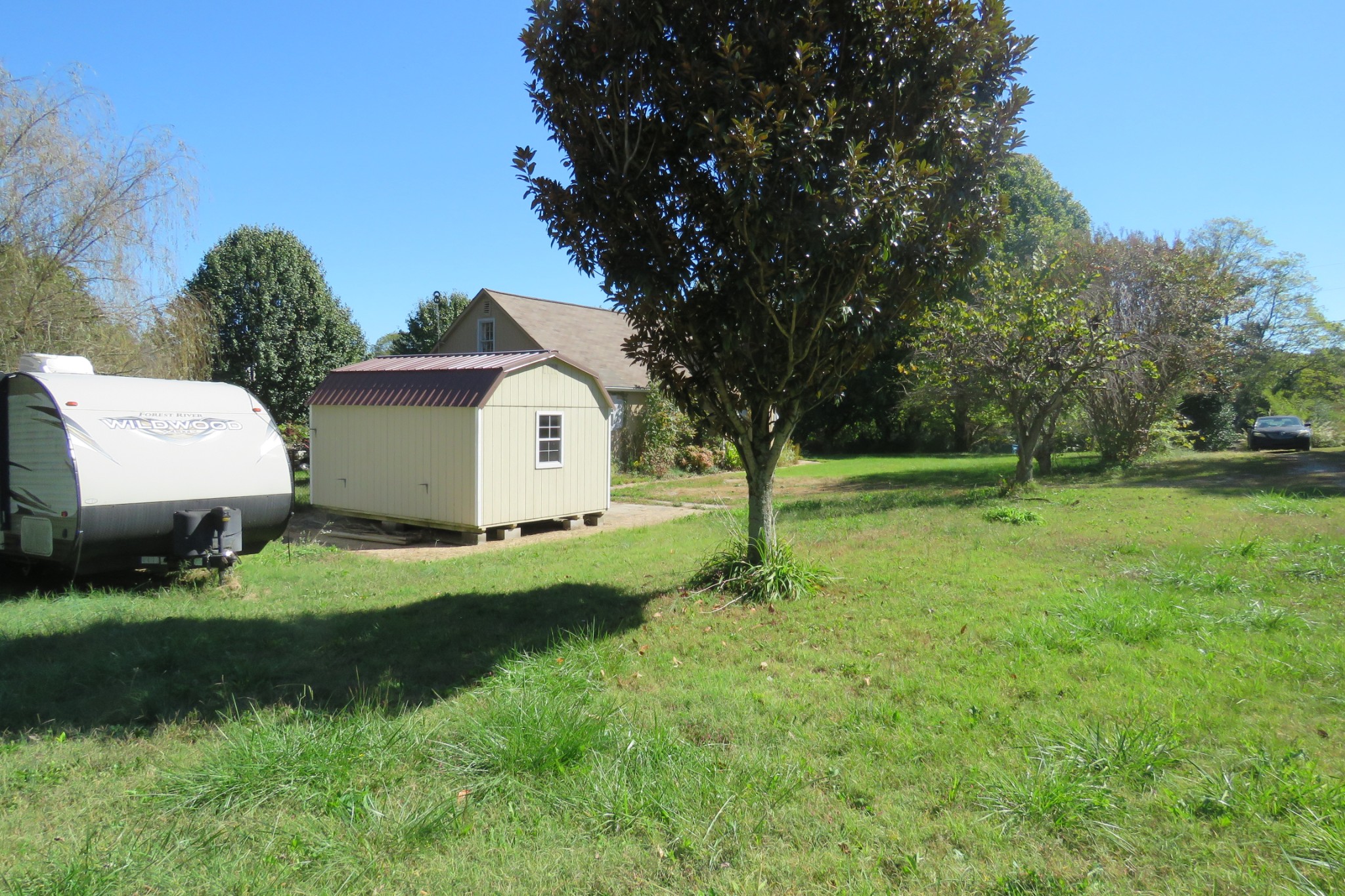 169 Dyer Ridge Road Baxter, TN 38544 - Photo 22 of 25 a view of an house with backyard space and tree