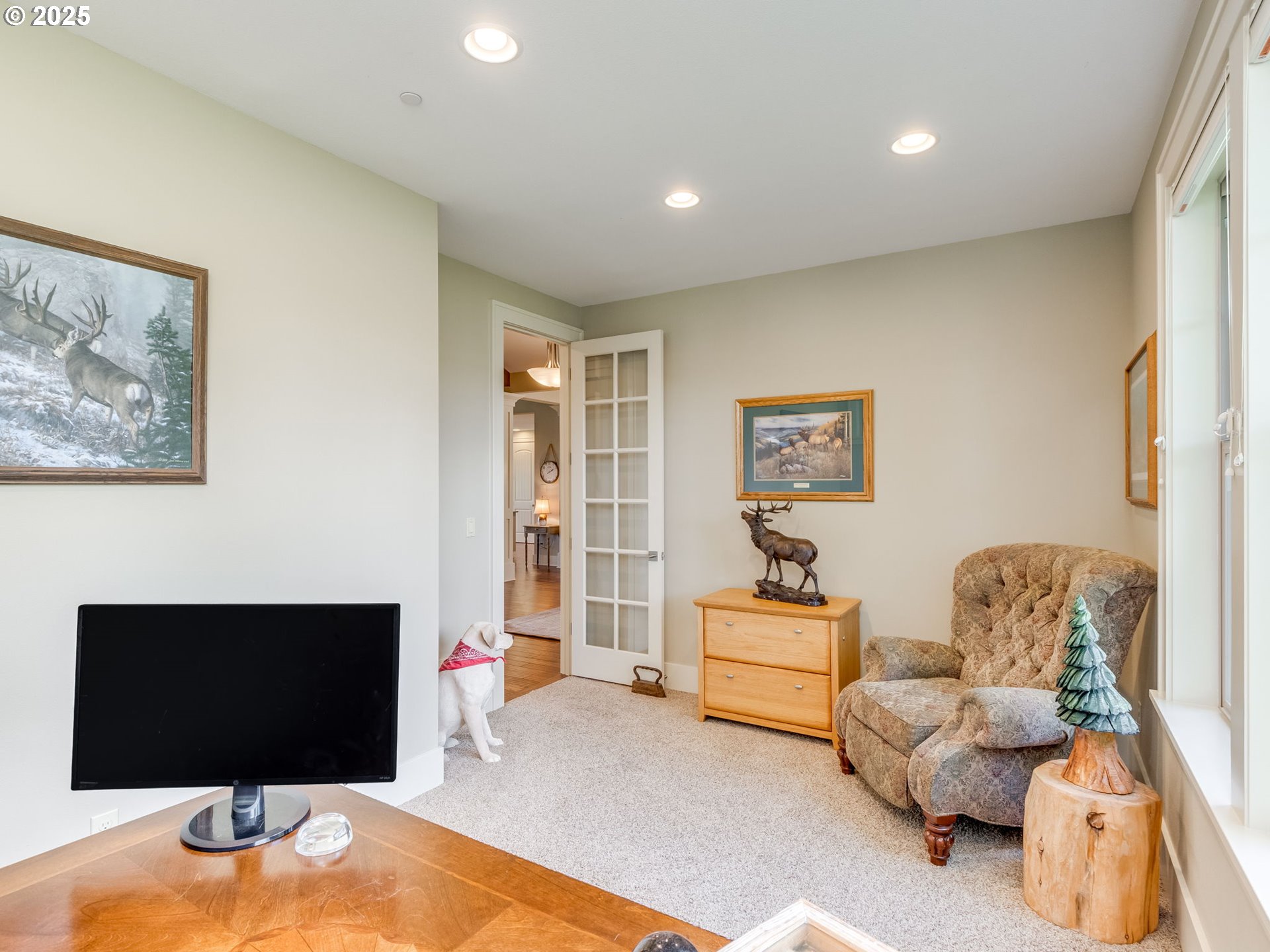 20321 Olmstead Road Northeast Aurora, OR 97002 - Photo 12 of 45 a living room with furniture and a flat screen tv