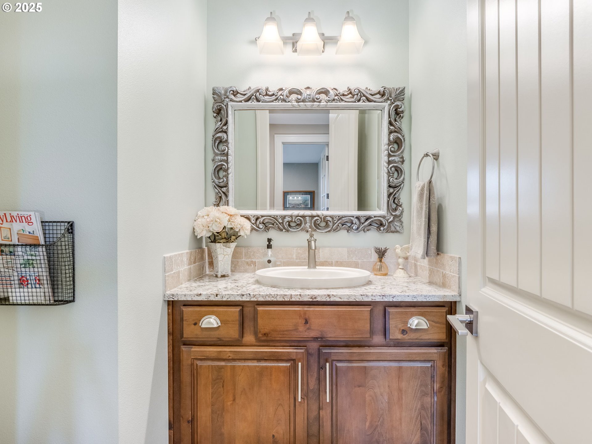 20321 Olmstead Road Northeast Aurora, OR 97002 - Photo 13 of 45 a bathroom with a granite countertop sink and a mirror