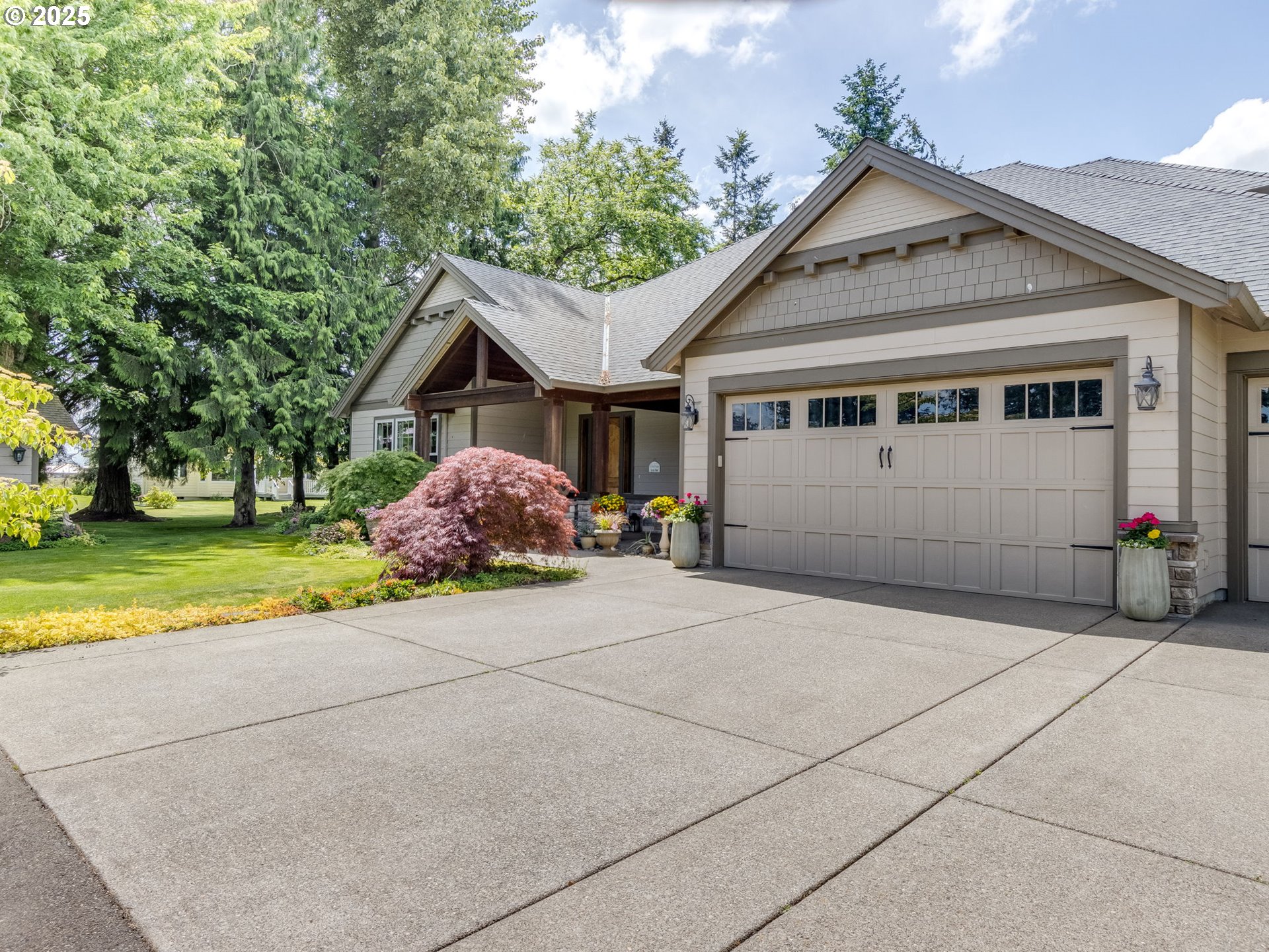 20321 Olmstead Road Northeast Aurora, OR 97002 - Photo 2 of 45 a front view of a house with a yard and garage