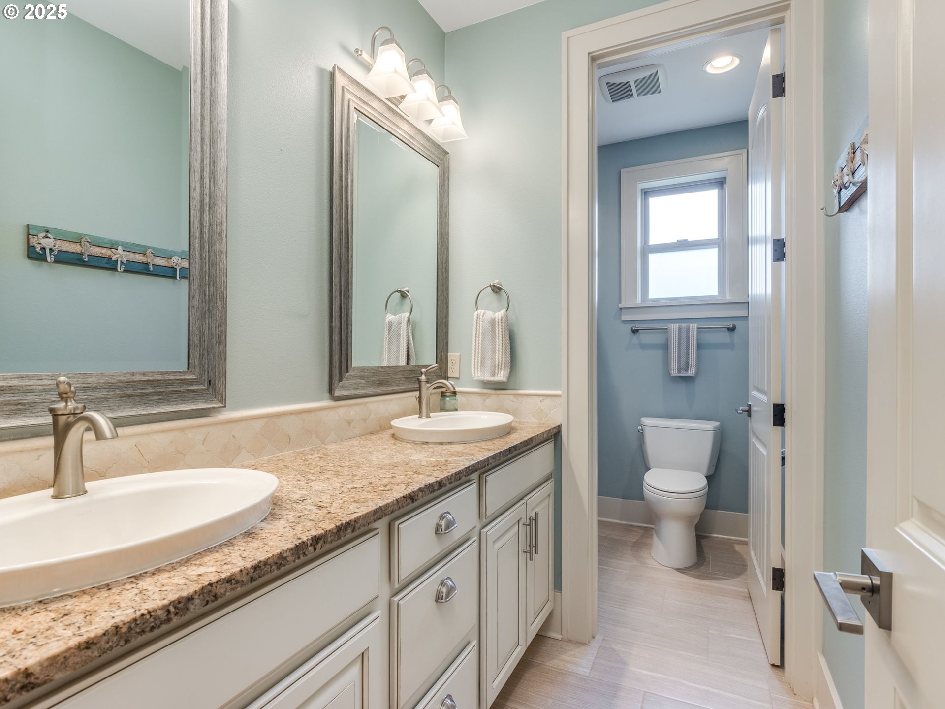 20321 Olmstead Road Northeast Aurora, OR 97002 - Photo 22 of 45 a bathroom with a granite countertop sink a toilet and a mirror