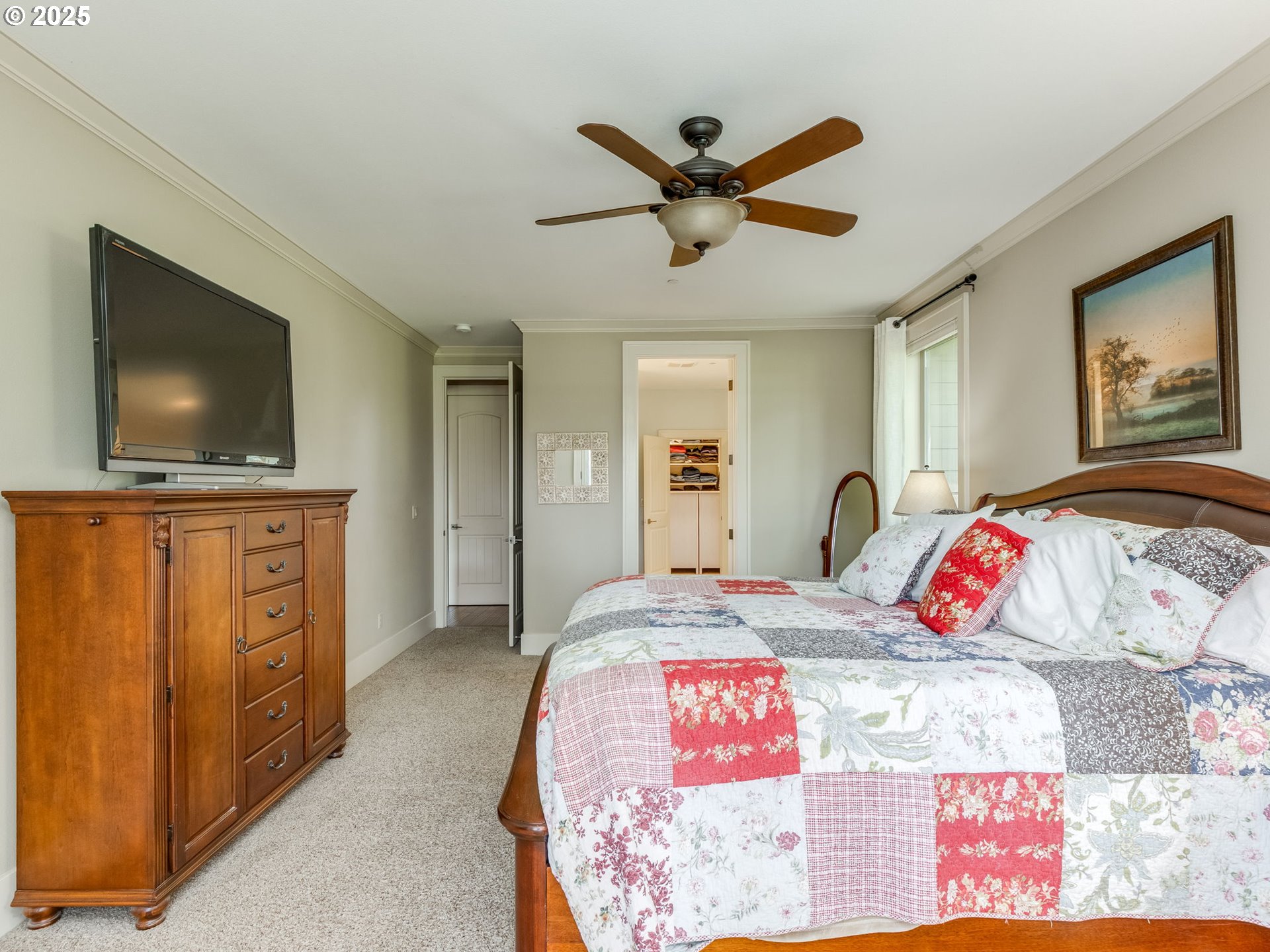 20321 Olmstead Road Northeast Aurora, OR 97002 - Photo 25 of 45 a bedroom with a bed and a flat screen tv