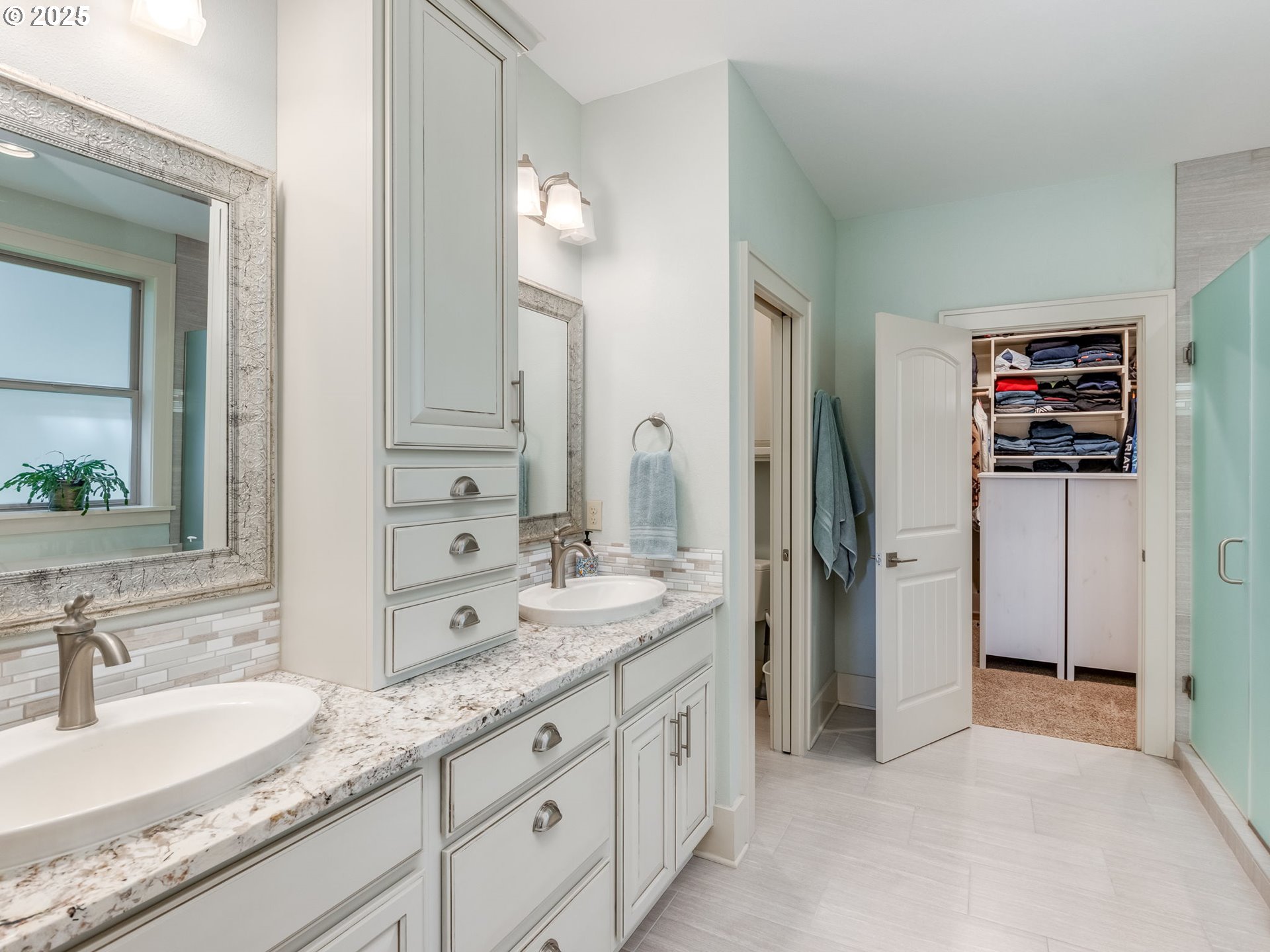 20321 Olmstead Road Northeast Aurora, OR 97002 - Photo 26 of 45 a spacious bathroom with a granite countertop sink and a mirror