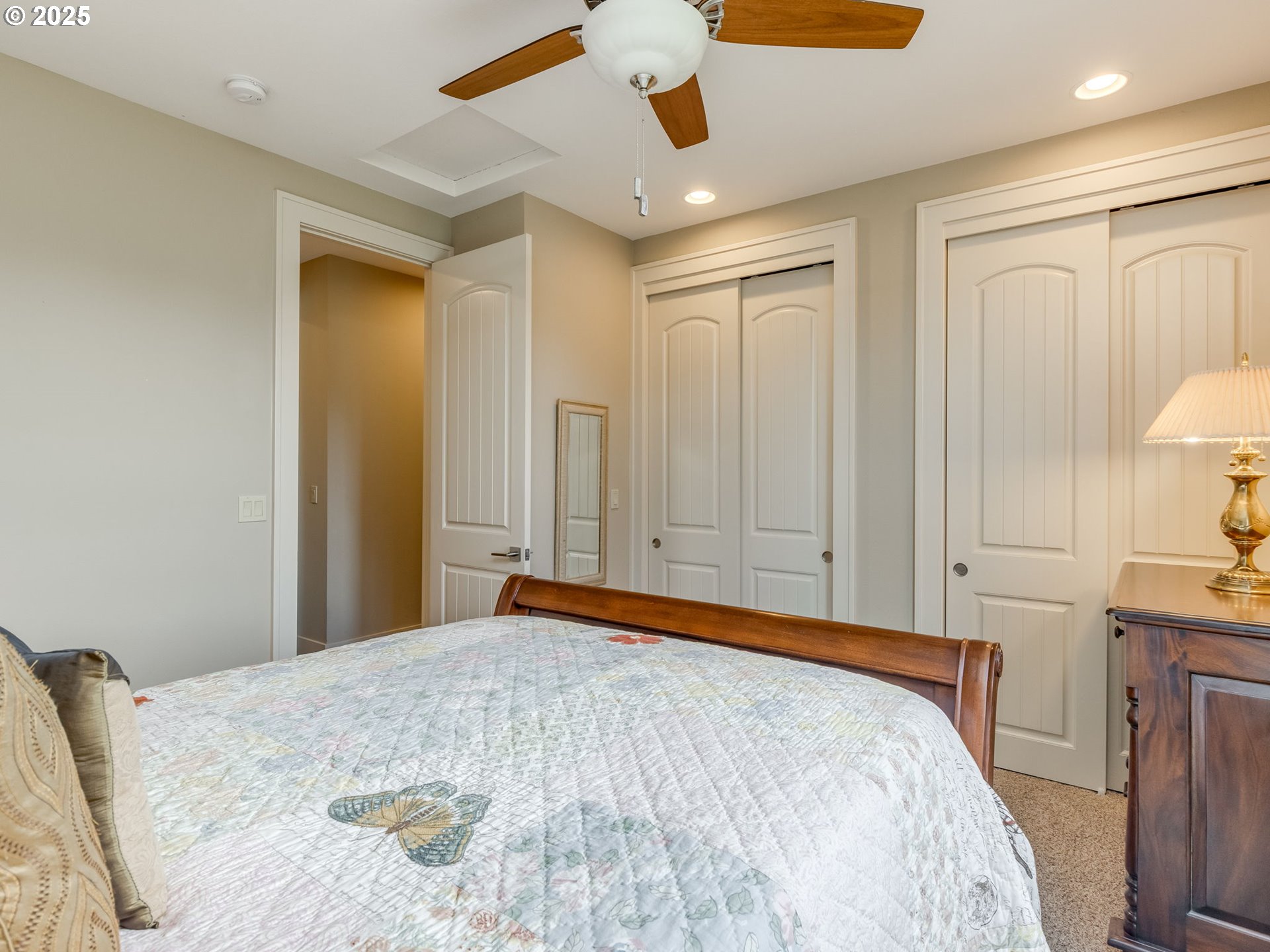20321 Olmstead Road Northeast Aurora, OR 97002 - Photo 30 of 45 a bedroom with a bed and a chandelier