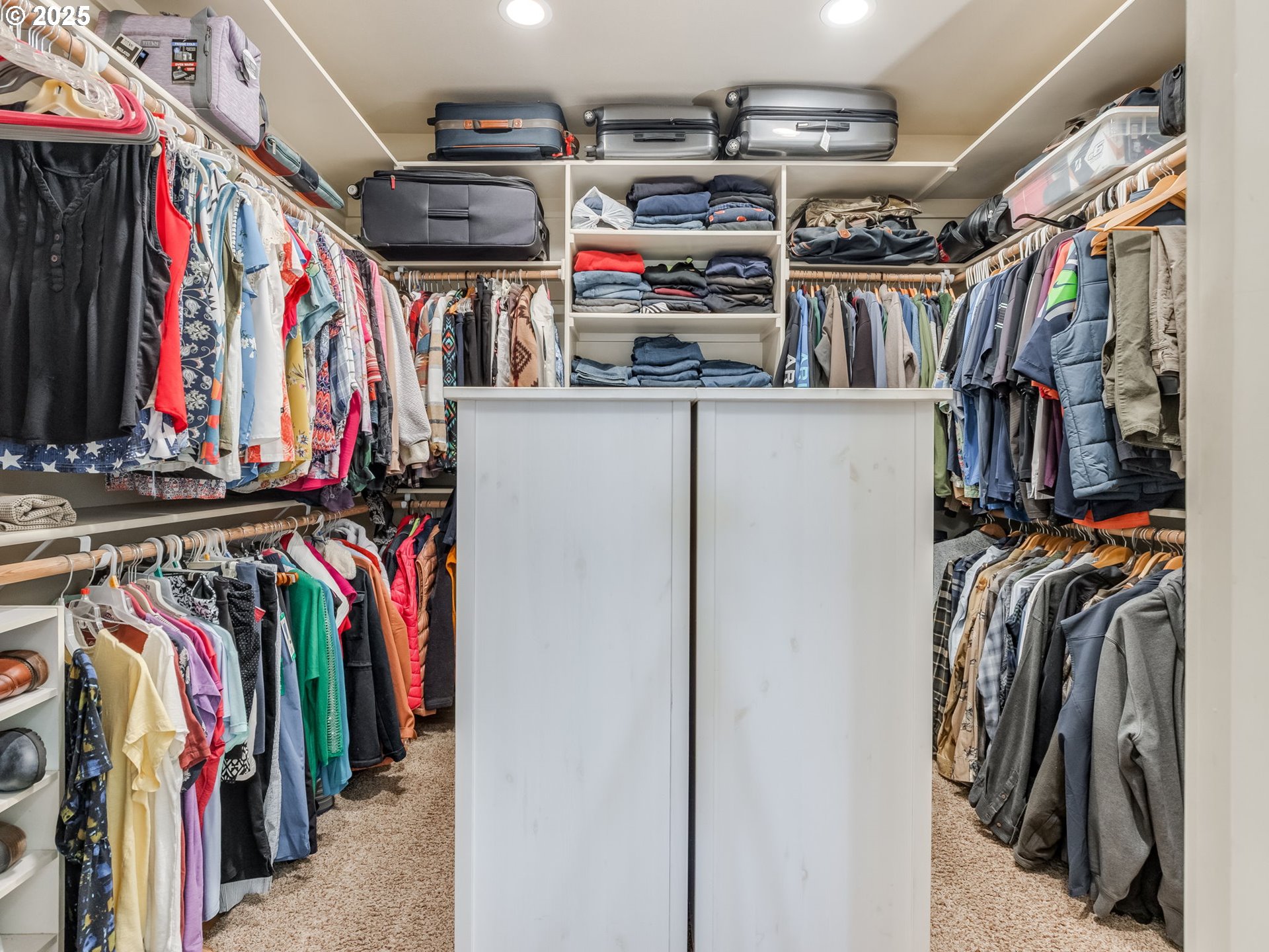 20321 Olmstead Road Northeast Aurora, OR 97002 - Photo 33 of 45 a view of walk in closet with clothes and shoes