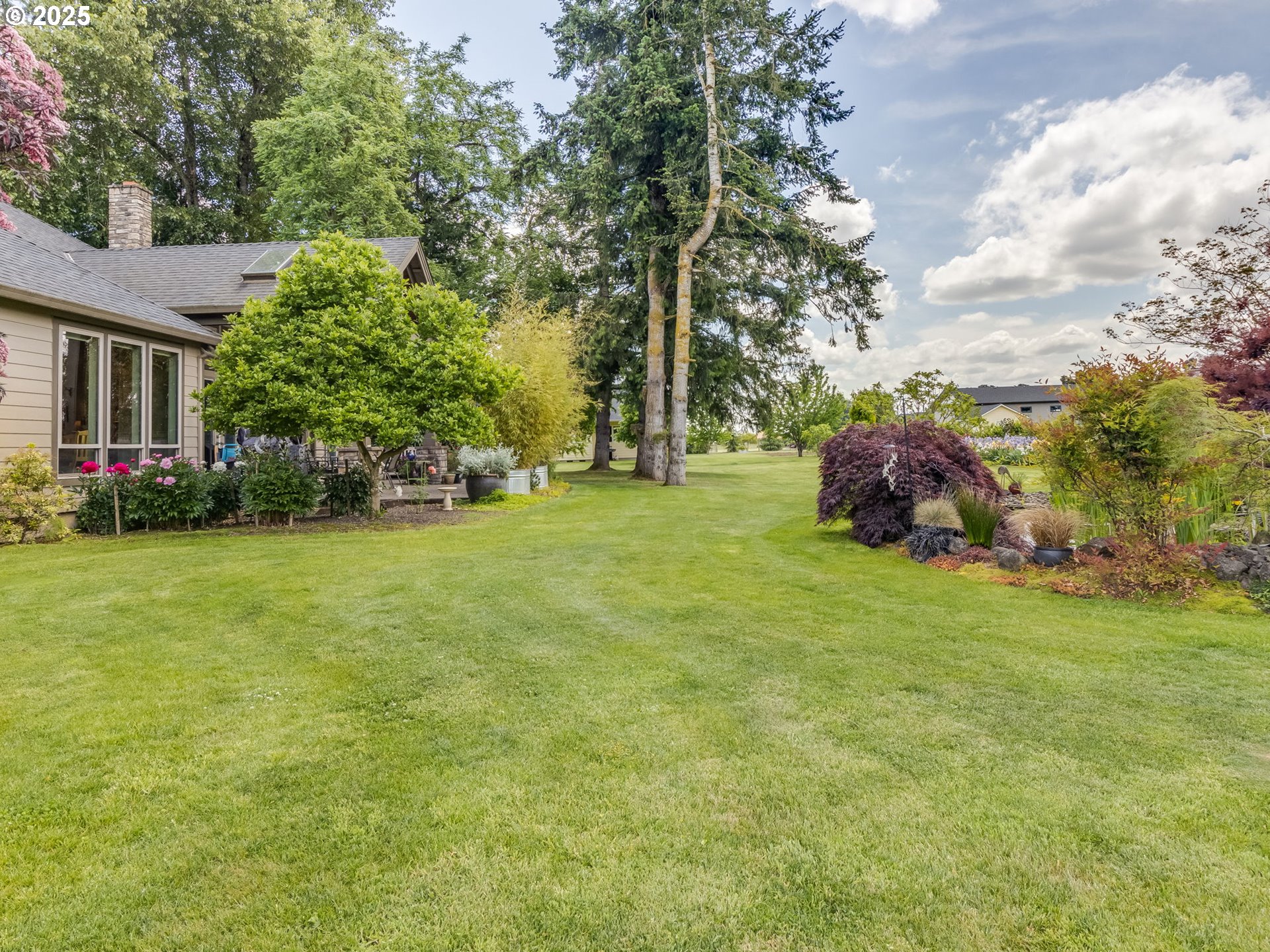20321 Olmstead Road Northeast Aurora, OR 97002 - Photo 36 of 45 a view of a trees in front of a house