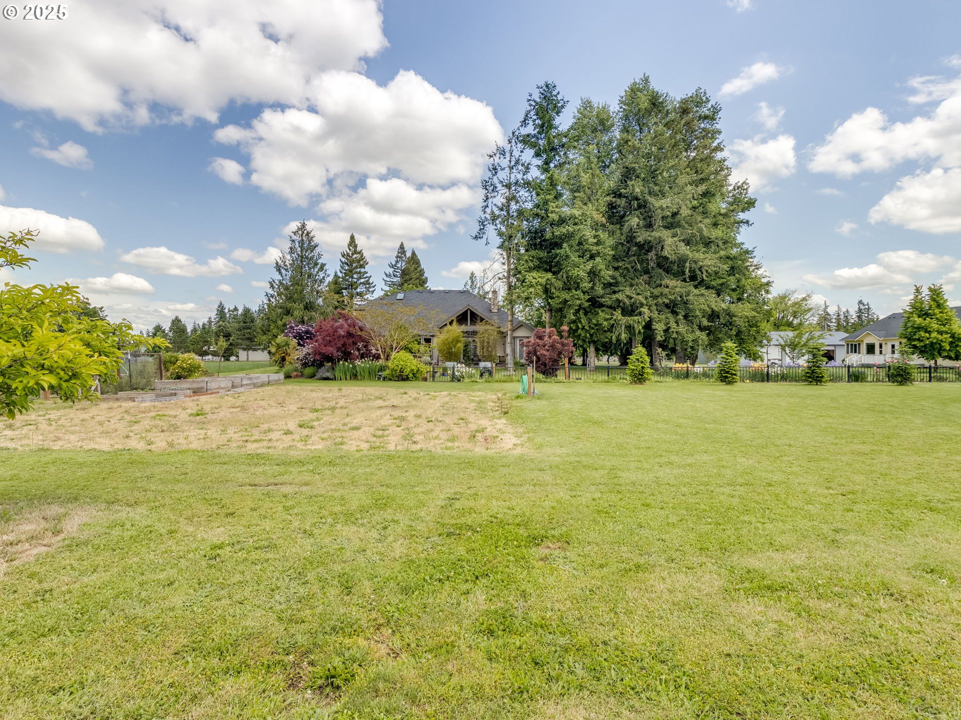 20321 Olmstead Road Northeast Aurora, OR 97002 - Photo 39 of 45 a view of a field with an trees in the background