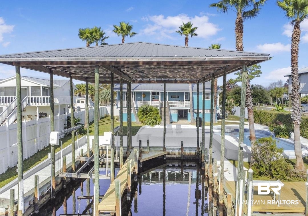 26318 Marina Road Orange Beach, AL 36561 - Photo 3 of 38 Dock featuring boat lift and a water view