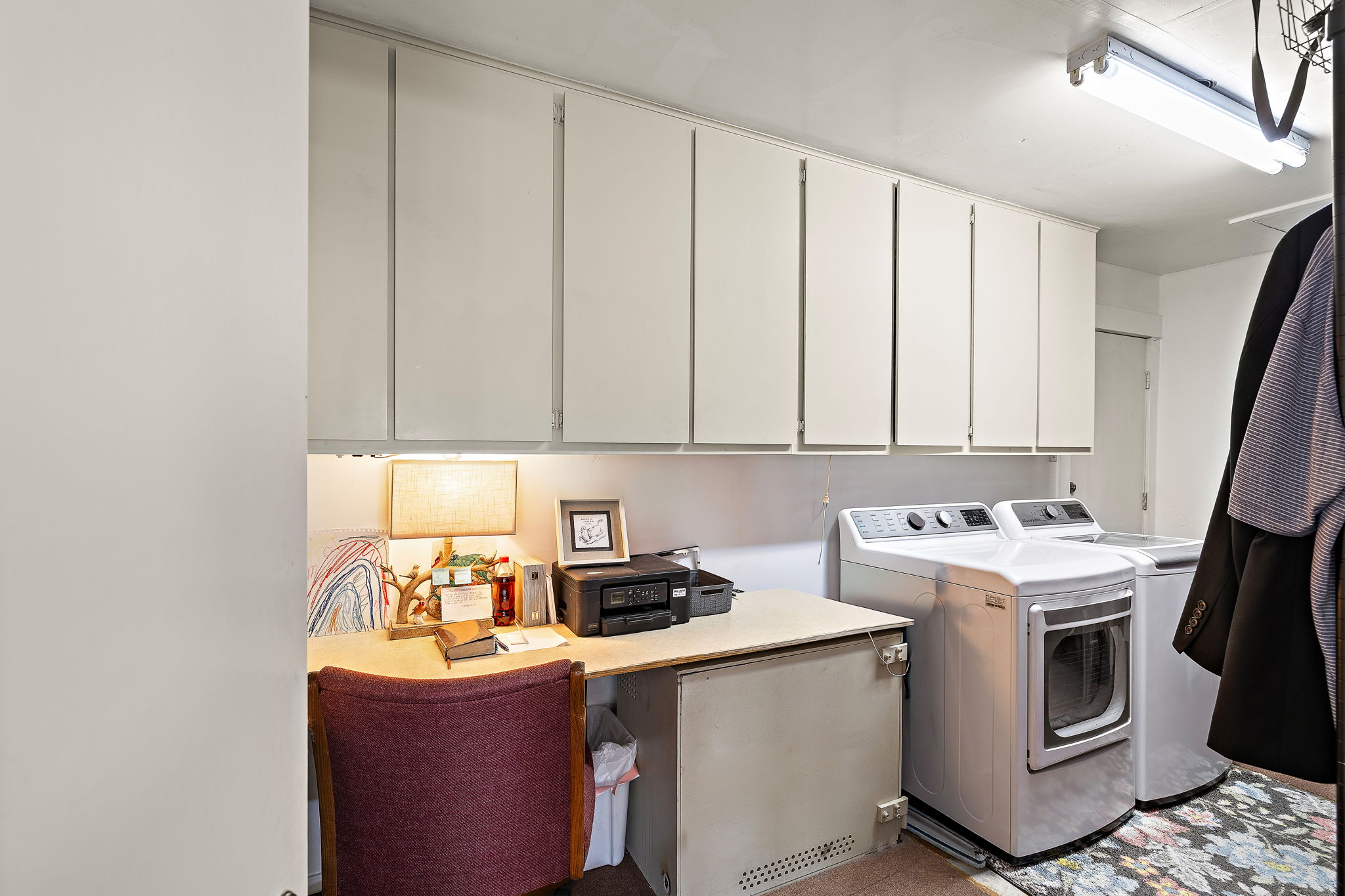 605 Parkway Street Georgetown, TX 78628 - Photo 25 of 31 Laundry room also has an office space and plenty of cabinets!