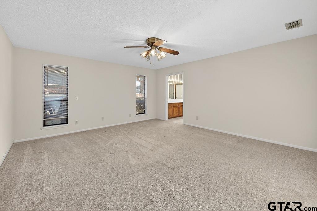 1111 Hillside Drive Athens, TX 75751 - Photo 11 of 20 a view of a livingroom with a ceiling fan and window