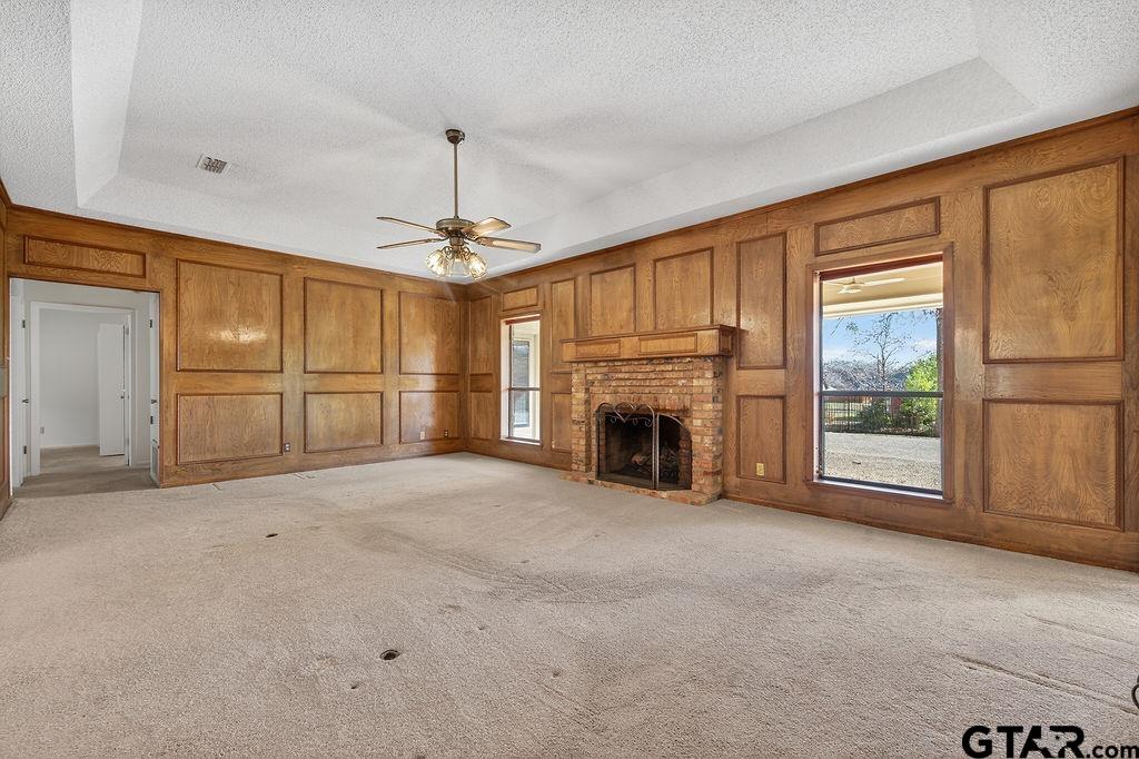 1111 Hillside Drive Athens, TX 75751 - Photo 2 of 20 an empty room with fireplace and windows