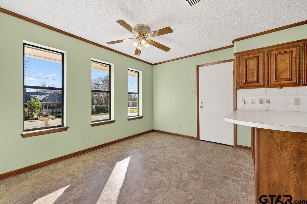 1111 Hillside Drive Athens, TX 75751 - Photo 10 of 20 a view of an empty room with window and cabinet