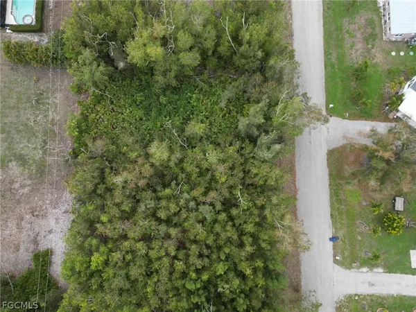 a aerial view of a houses with yard