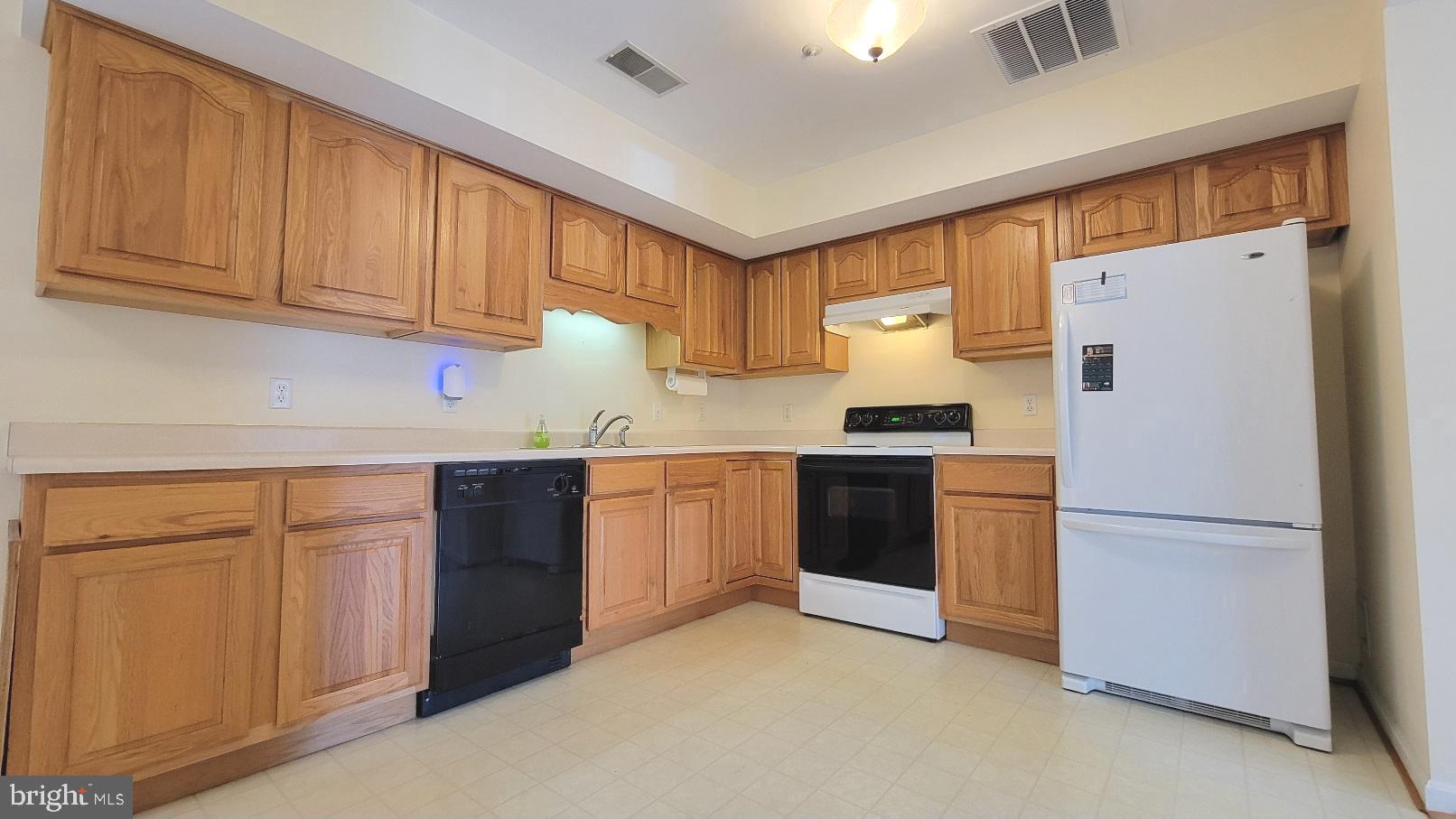337 East Ridge Drive Hagerstown, MD 21740 - Photo 3 of 17 a kitchen with a refrigerator sink and cabinets