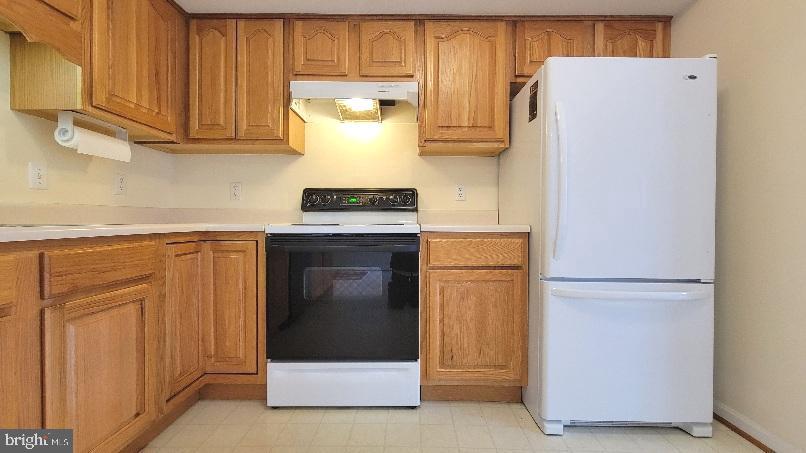 337 East Ridge Drive Hagerstown, MD 21740 - Photo 5 of 17 a kitchen with a refrigerator and cabinets