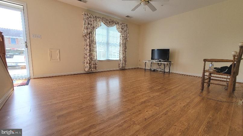 337 East Ridge Drive Hagerstown, MD 21740 - Photo 7 of 17 an empty room with wooden floor and windows