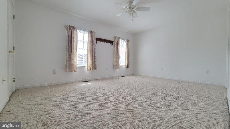 337 East Ridge Drive Hagerstown, MD 21740 - Photo 10 of 17 an empty room with windows and fan