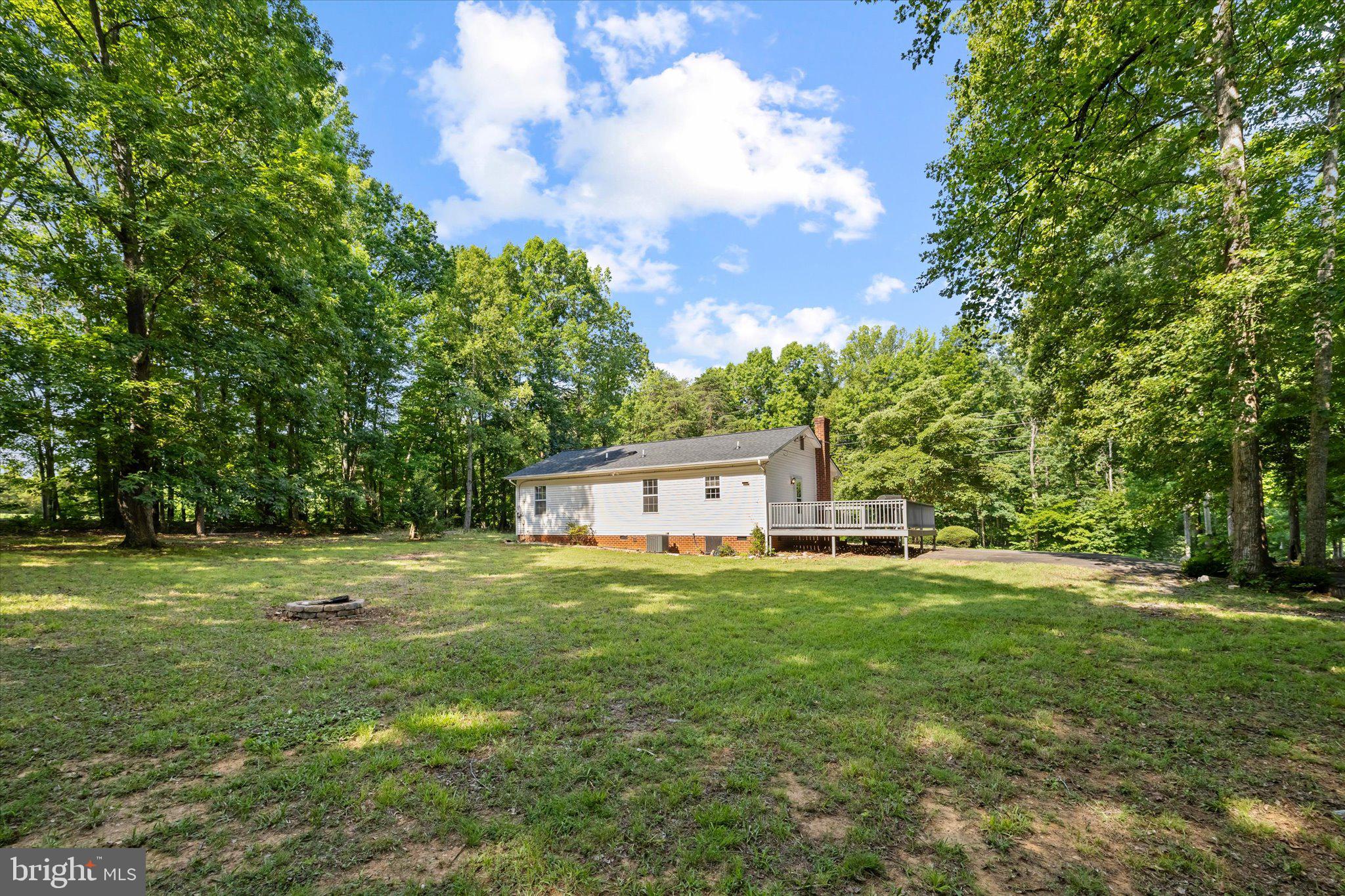 252 Evergreen Road Louisa, VA 23093 - Photo 32 of 39 backyard with firepit
