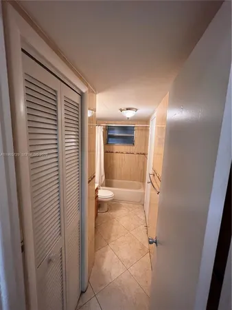 a bathroom with a shower and a toilet