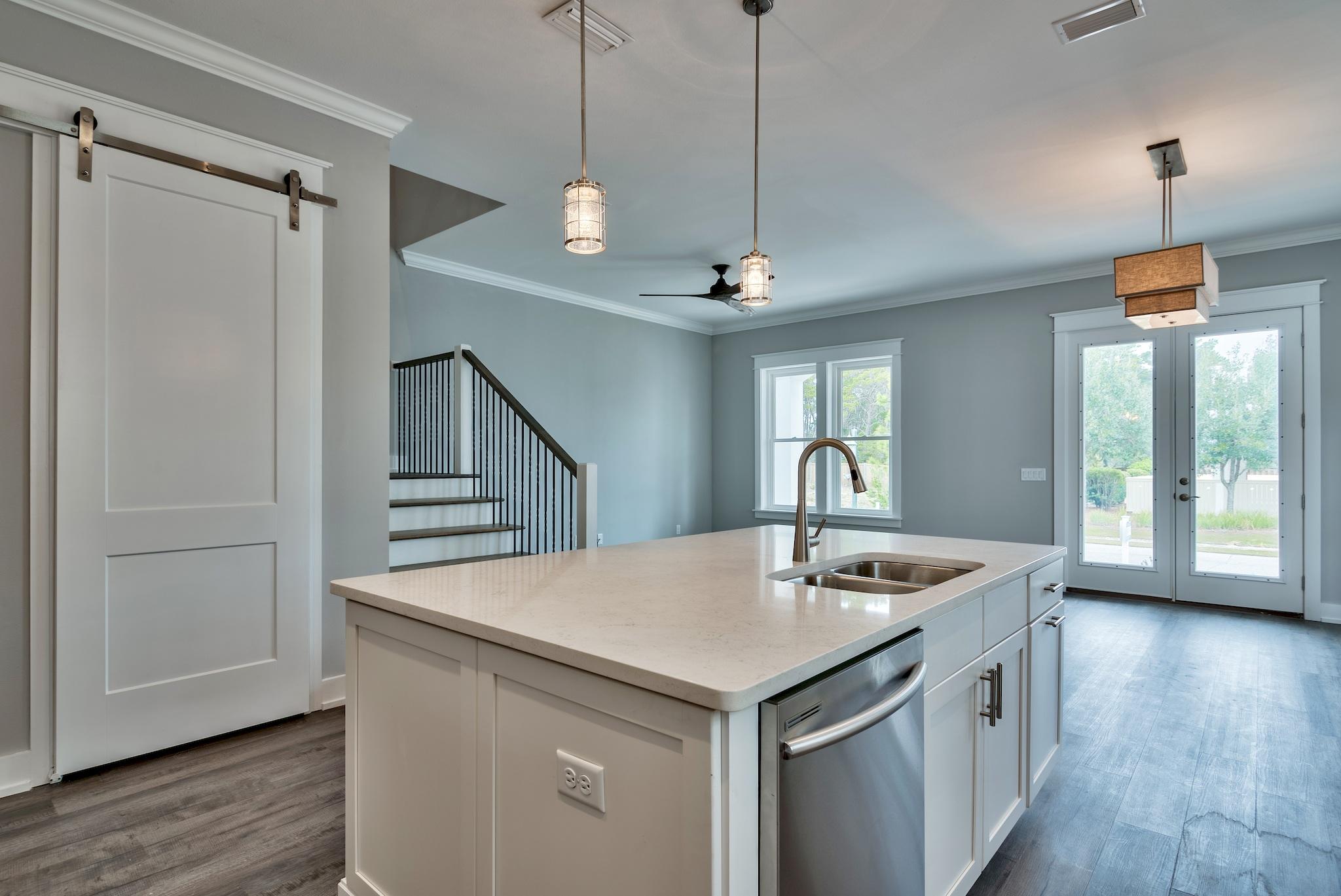 Lot 29 West Willow Mist Rd Inlet Beach Inlet Beach, FL 32461 - Photo 11 of 28 a kitchen with a sink a counter space and a refrigerator