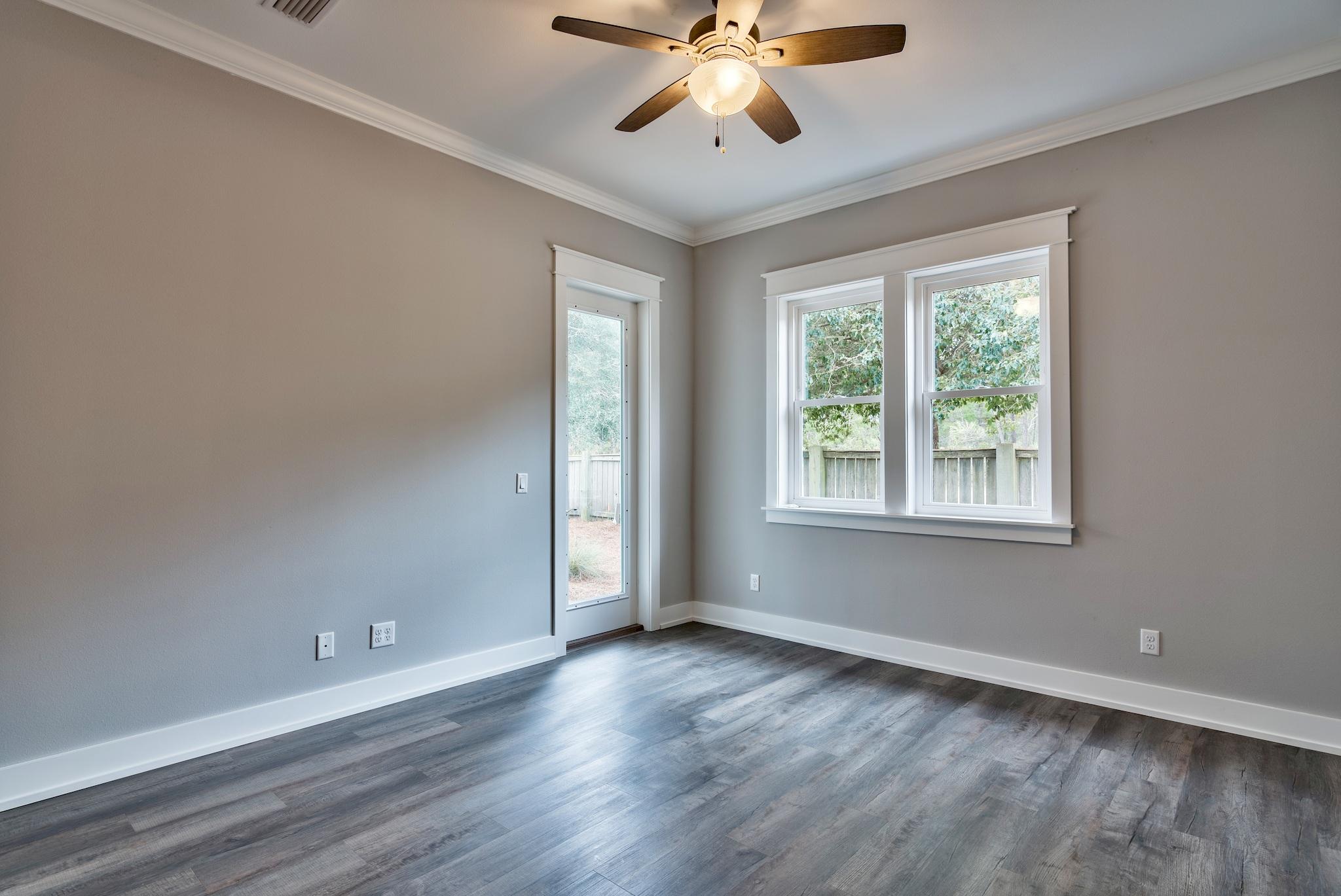 Lot 29 West Willow Mist Rd Inlet Beach Inlet Beach, FL 32461 - Photo 13 of 28 a view of an empty room with wooden floor and a window