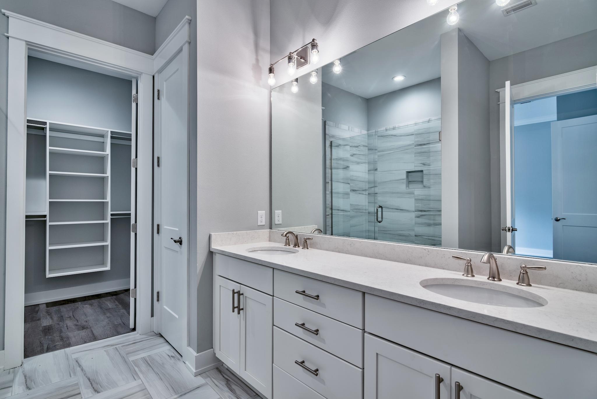 Lot 29 West Willow Mist Rd Inlet Beach Inlet Beach, FL 32461 - Photo 16 of 28 a bathroom with a double vanity sink and a mirror
