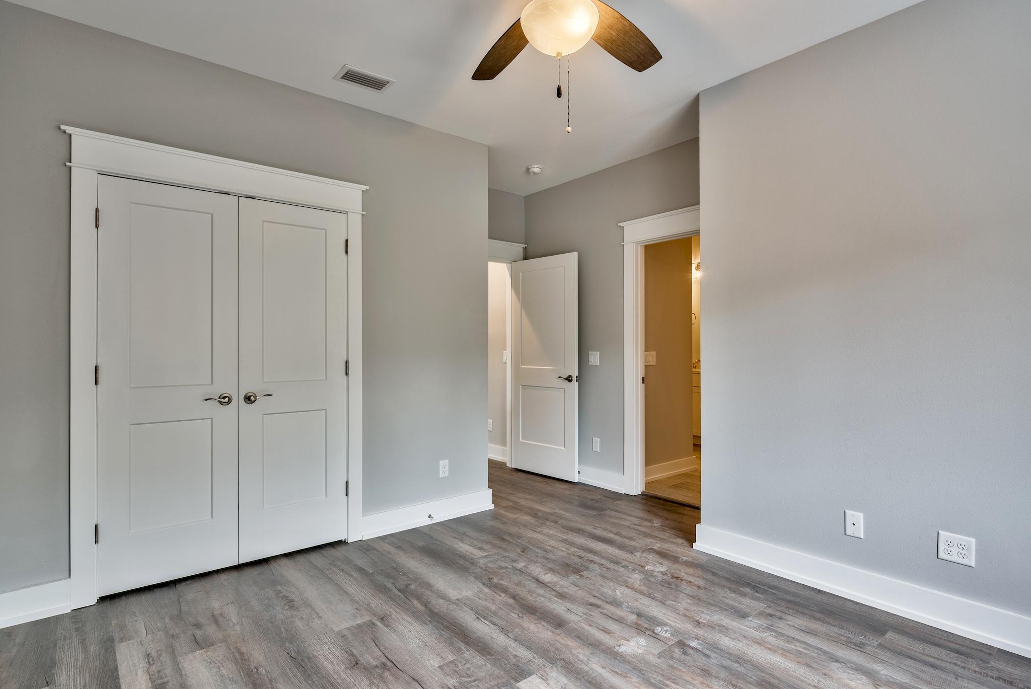 Lot 29 West Willow Mist Rd Inlet Beach Inlet Beach, FL 32461 - Photo 19 of 28 an empty room with wooden floor and windows